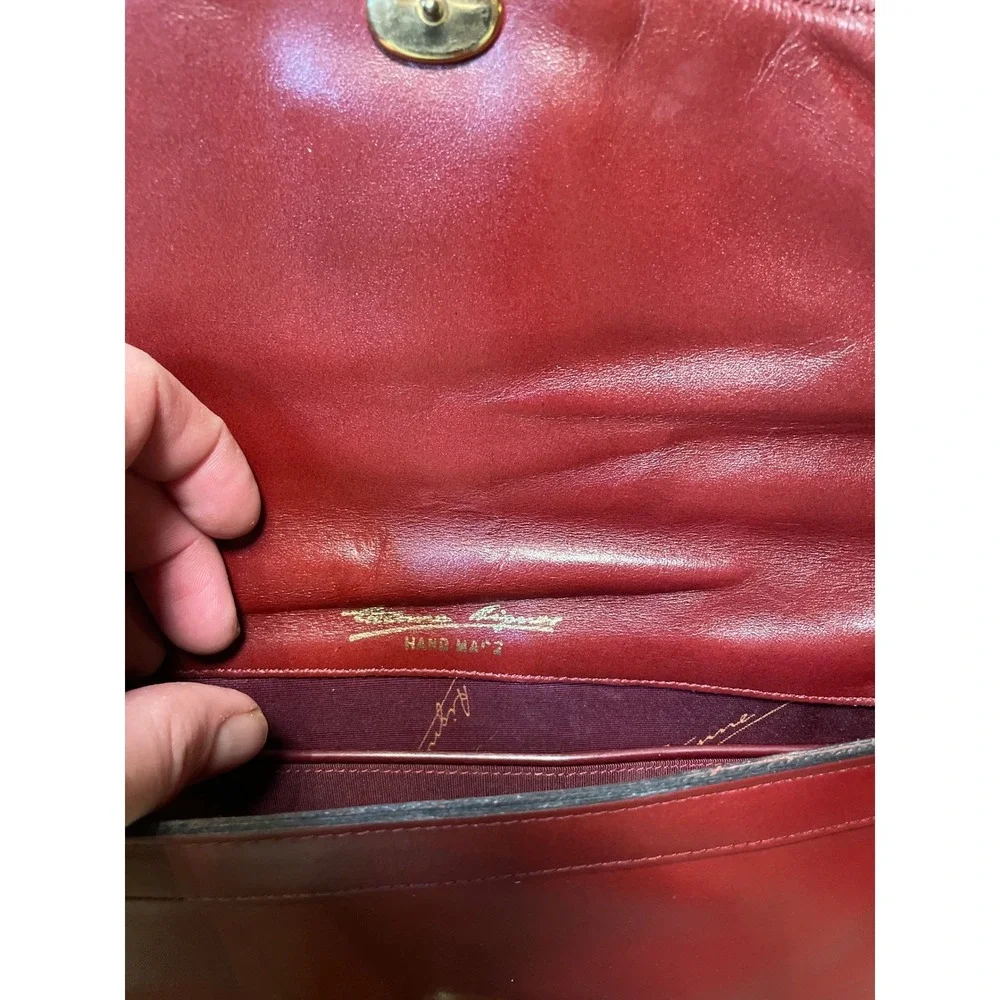 Elegant‎ Burgundy Etienne Aigner Leather Clutch Handbag with Gold Oval Accent